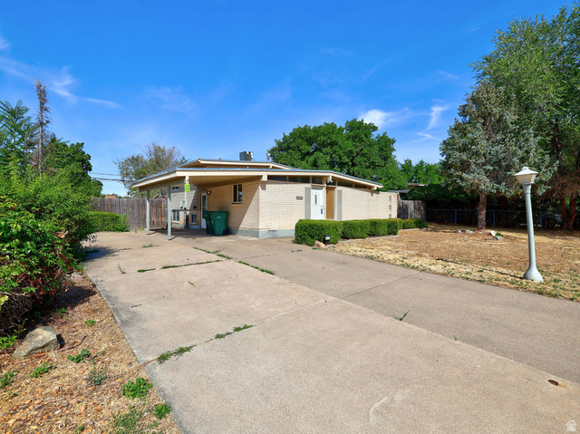 669 Colonial Avenue Layton, UT 84041 - Photo 2 of 51 Light brick exterior with covered carport