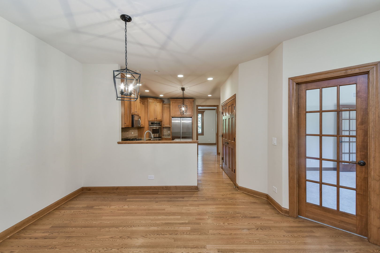 2003 Mackenzie Place Wheaton, IL 60187 - Photo 11 of 25 a view of a kitchen with a refrigerator