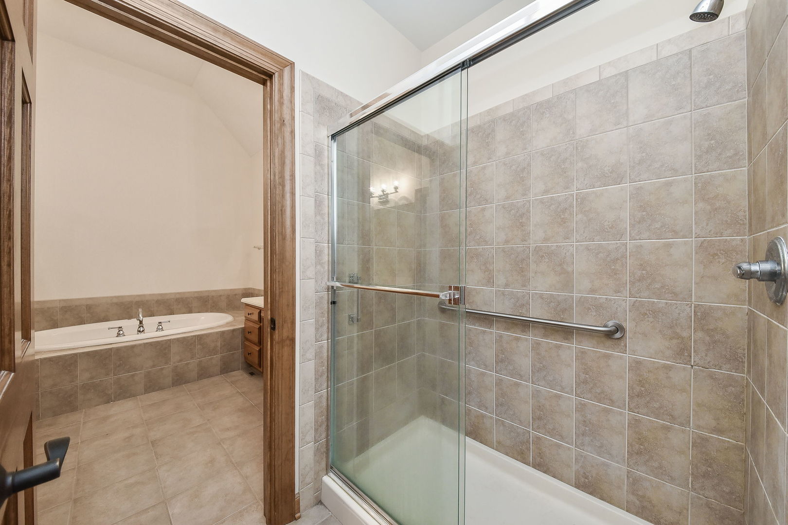 2003 Mackenzie Place Wheaton, IL 60187 - Photo 17 of 25 a bathroom with a bathtub and a shower