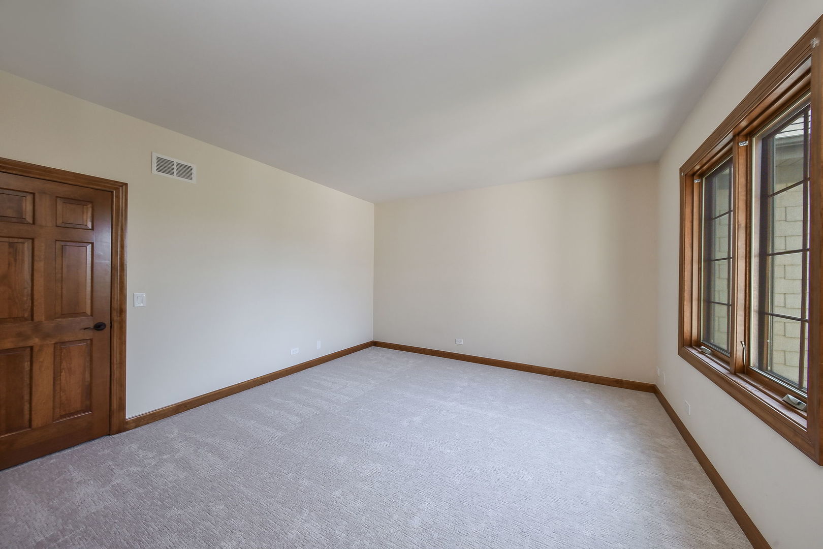 2003 Mackenzie Place Wheaton, IL 60187 - Photo 18 of 25 an empty room with windows