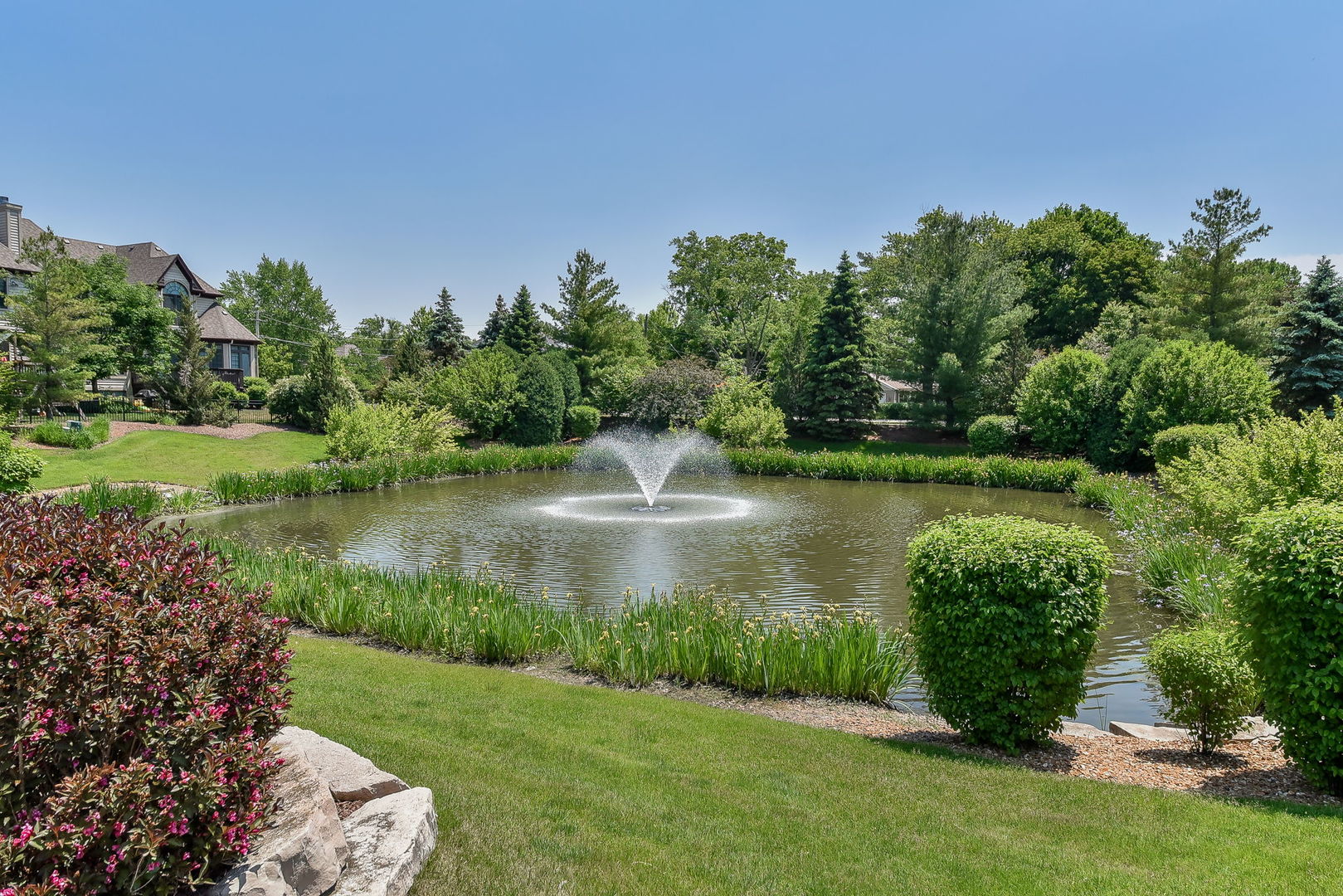 2003 Mackenzie Place Wheaton, IL 60187 - Photo 25 of 25 a view of a lake with a building in the background