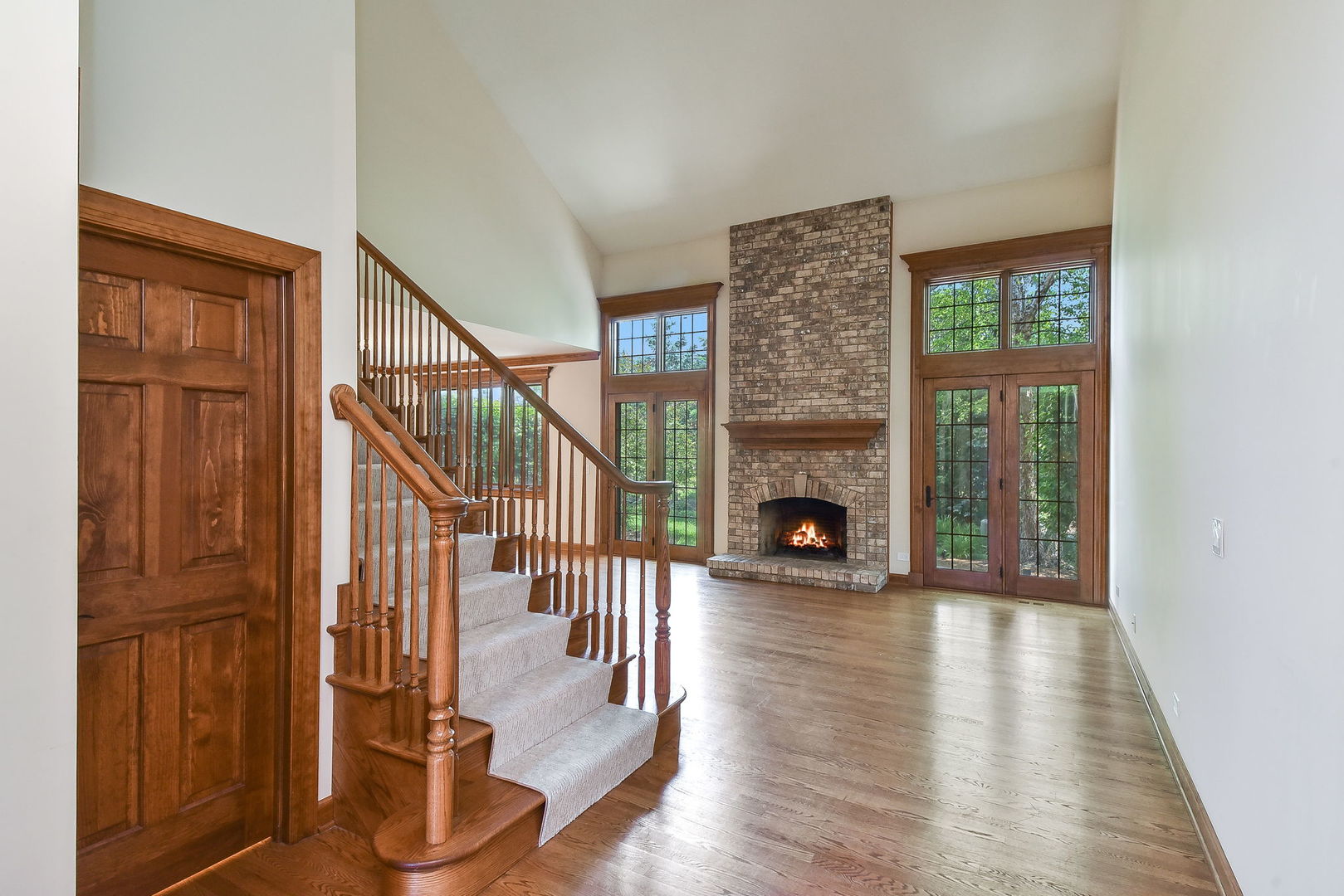 2003 Mackenzie Place Wheaton, IL 60187 - Photo 3 of 25 a view of a livingroom with wooden floor fireplace and windows