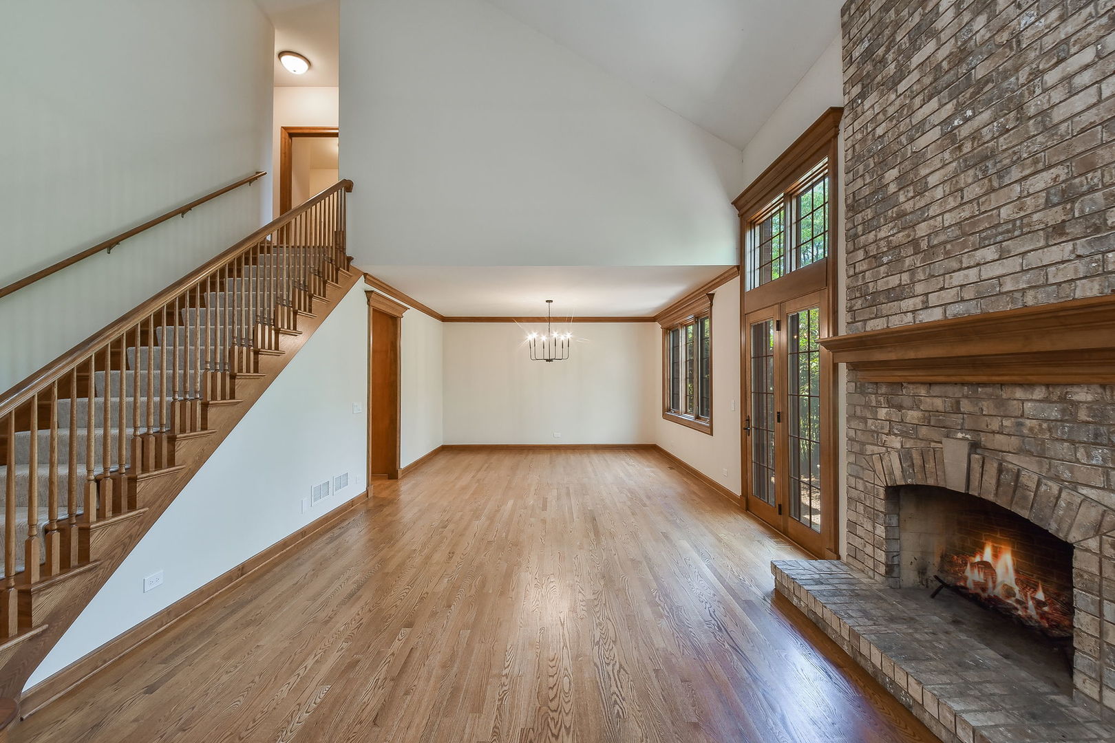 2003 Mackenzie Place Wheaton, IL 60187 - Photo 4 of 25 a view of empty room with wooden floor and fireplace