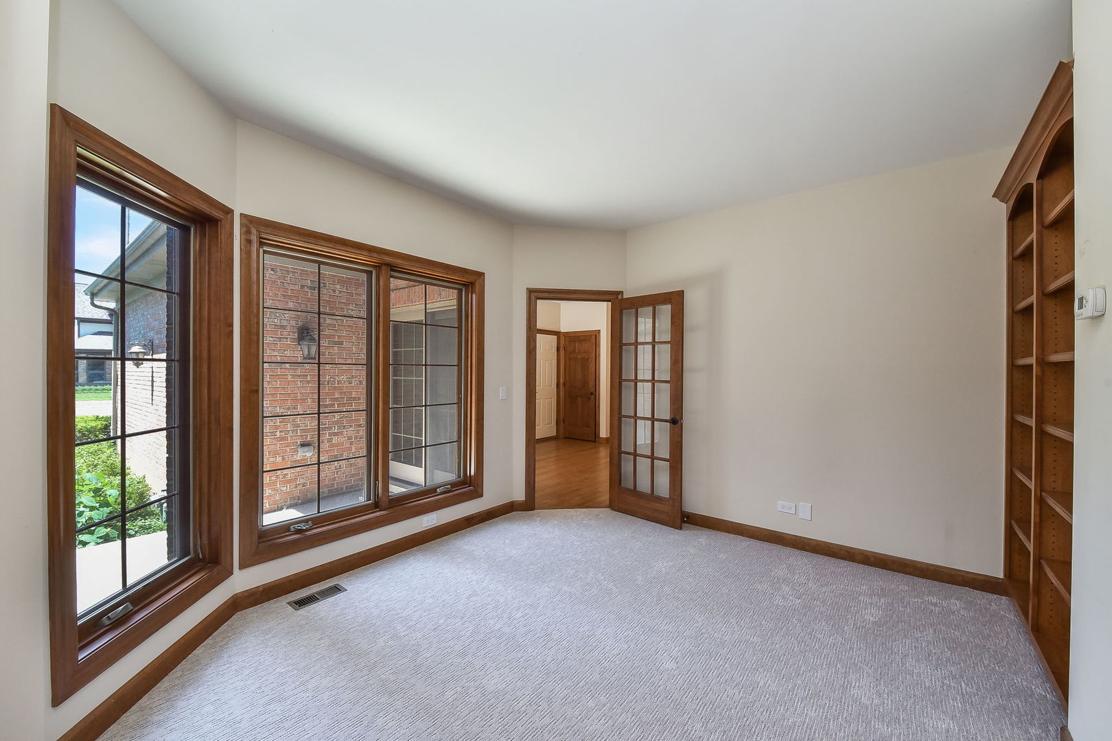 2003 Mackenzie Place Wheaton, IL 60187 - Photo 7 of 25 a view of an empty room with glass door and balcony