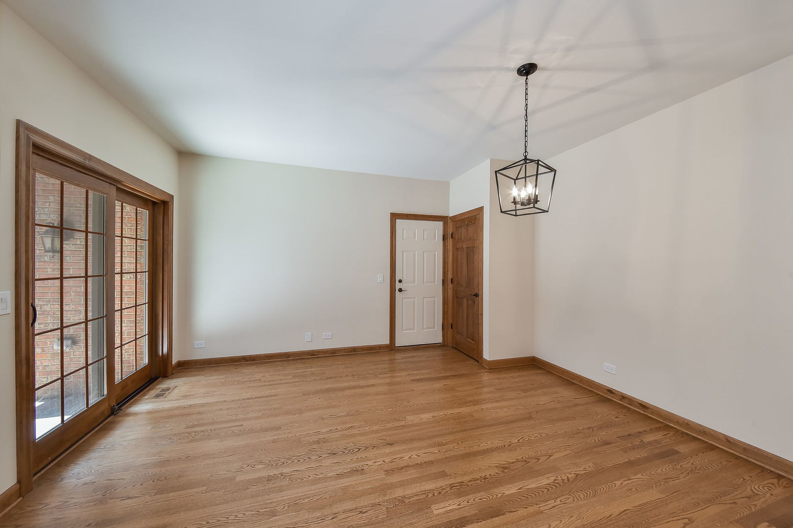 2003 Mackenzie Place Wheaton, IL 60187 - Photo 10 of 25 a view of an empty room with wooden floor and a window