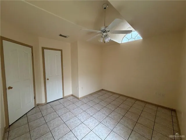 a en suite bathroom with a granite countertop sink toilet and shower