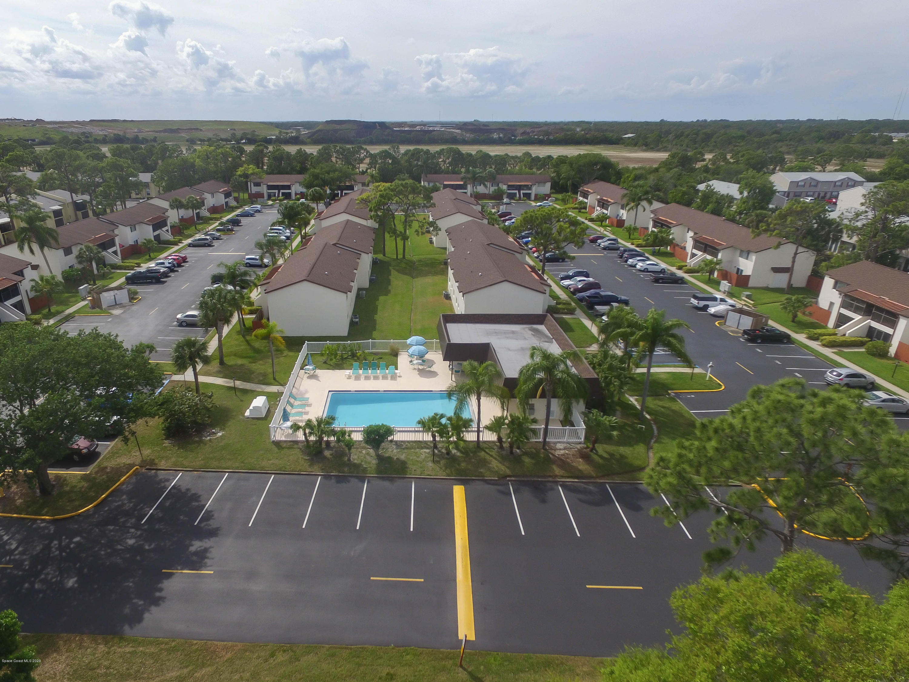 610 North Wickham Road, Unit 74 Melbourne, FL 32935 - Photo 2 of 46 an aerial view of residential houses with outdoor space and ocean view
