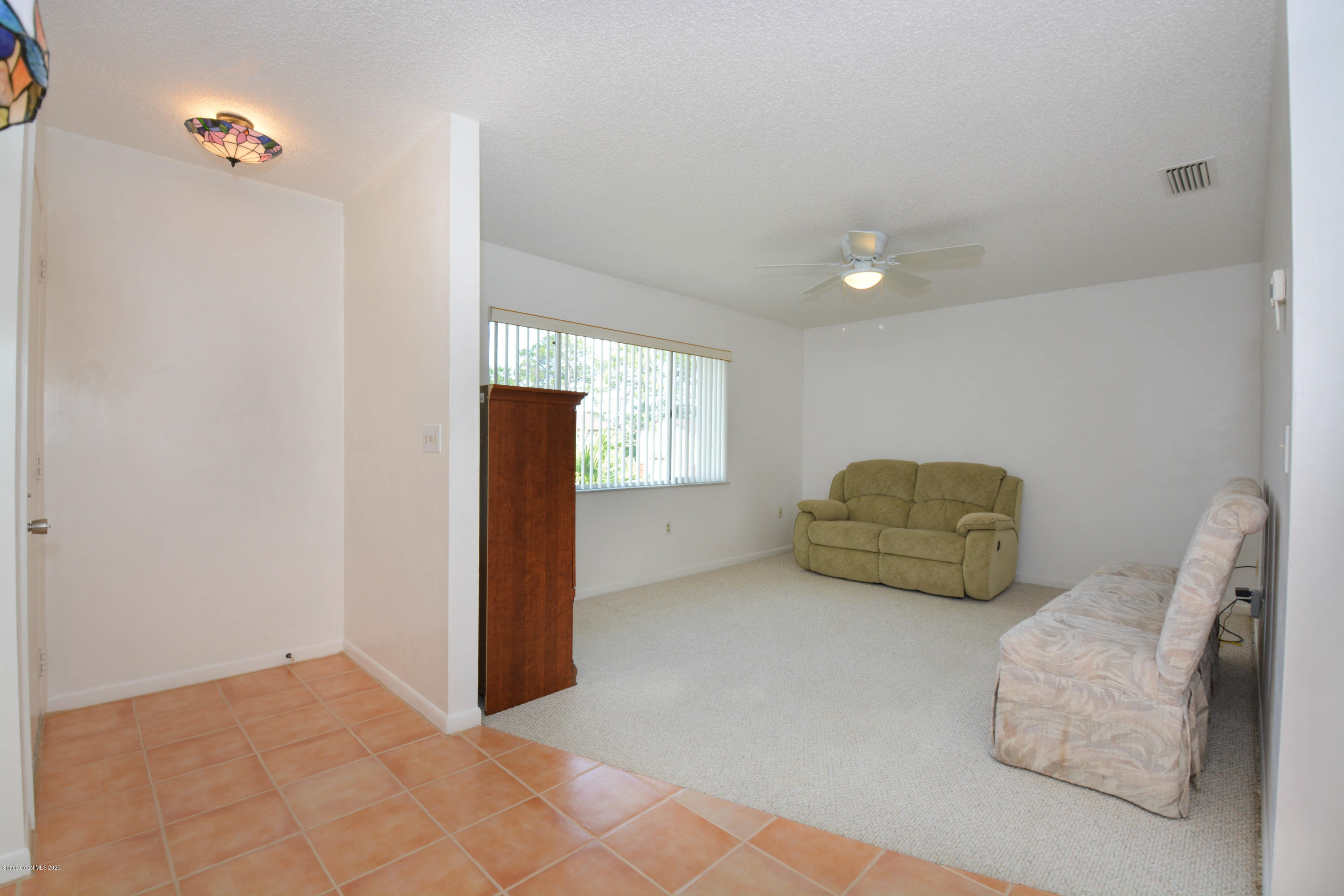 610 North Wickham Road, Unit 74 Melbourne, FL 32935 - Photo 14 of 46 a view of furniture and window in livingroom