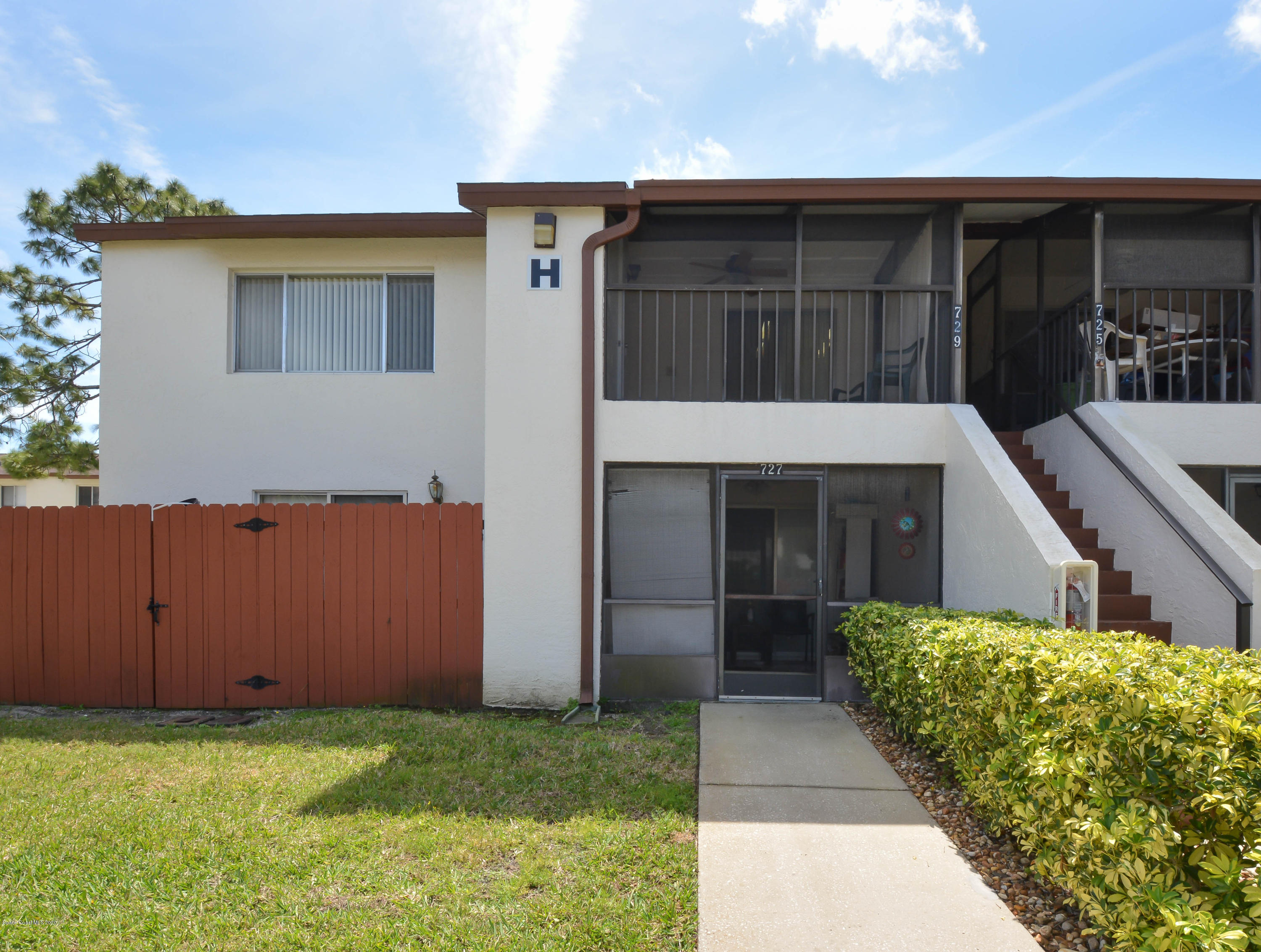 610 North Wickham Road, Unit 74 Melbourne, FL 32935 - Photo 3 of 46 a view of a house with a small cabin