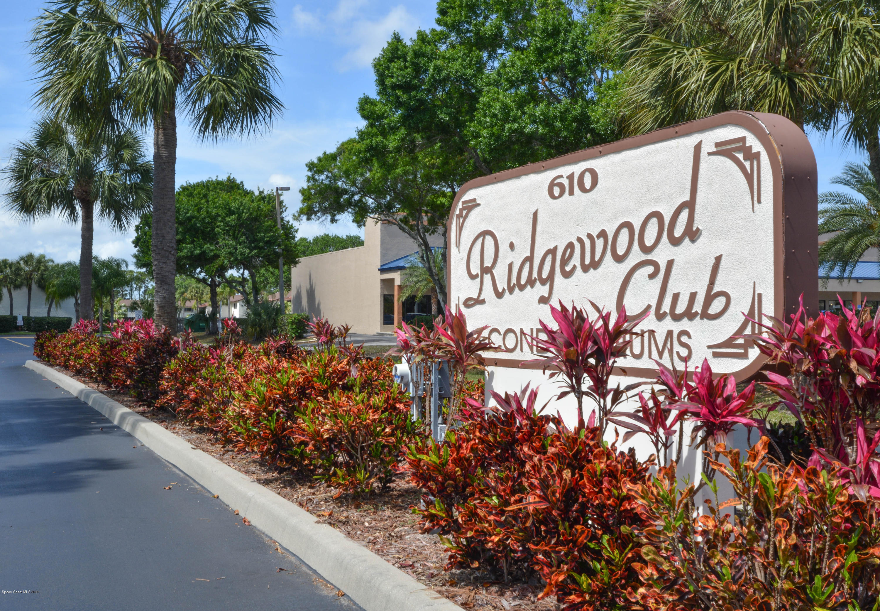 610 North Wickham Road, Unit 74 Melbourne, FL 32935 - Photo 25 of 46 a sign on the side of a building