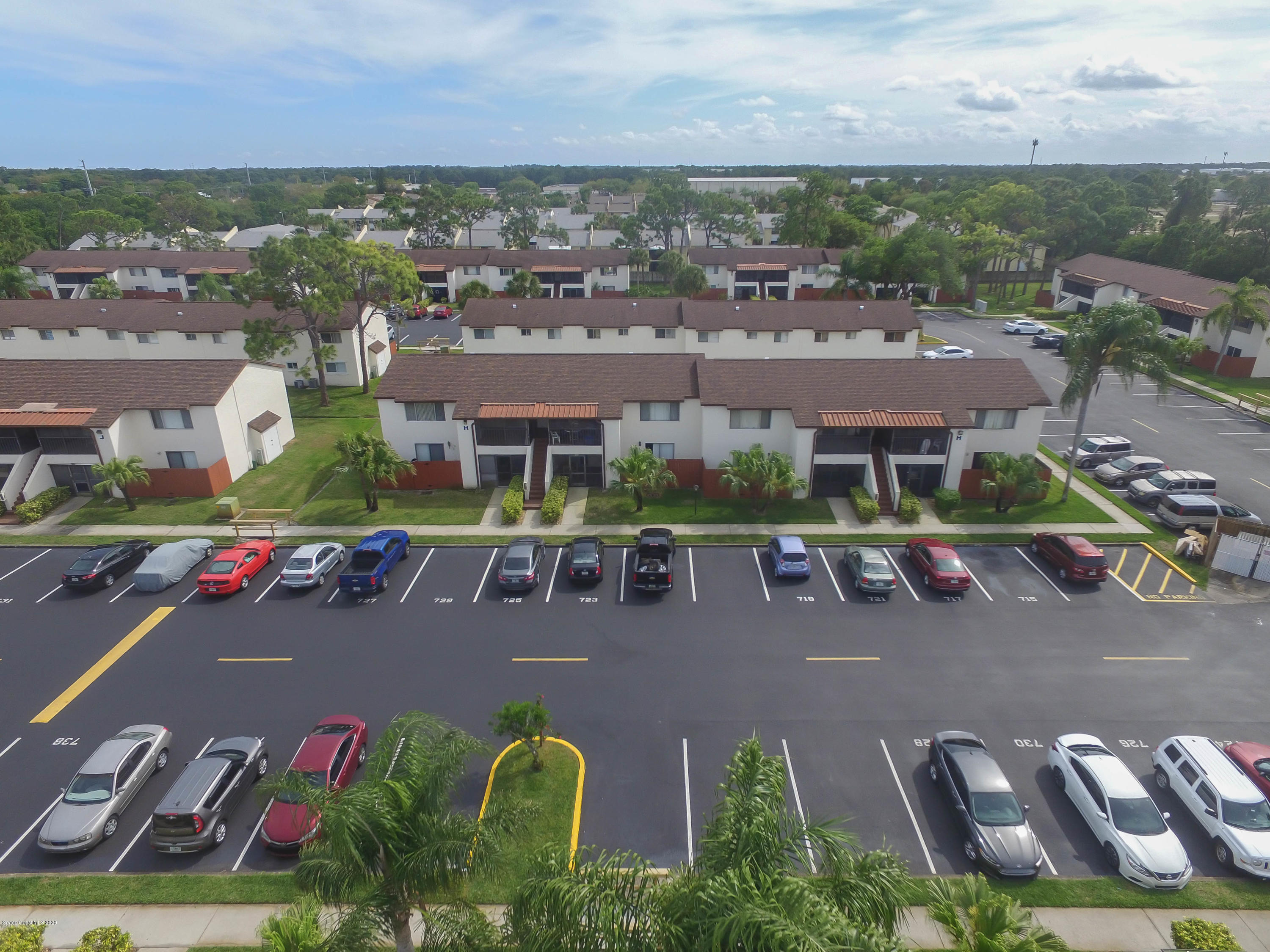 610 North Wickham Road, Unit 74 Melbourne, FL 32935 - Photo 26 of 46 an aerial view of a house with garden space and street view