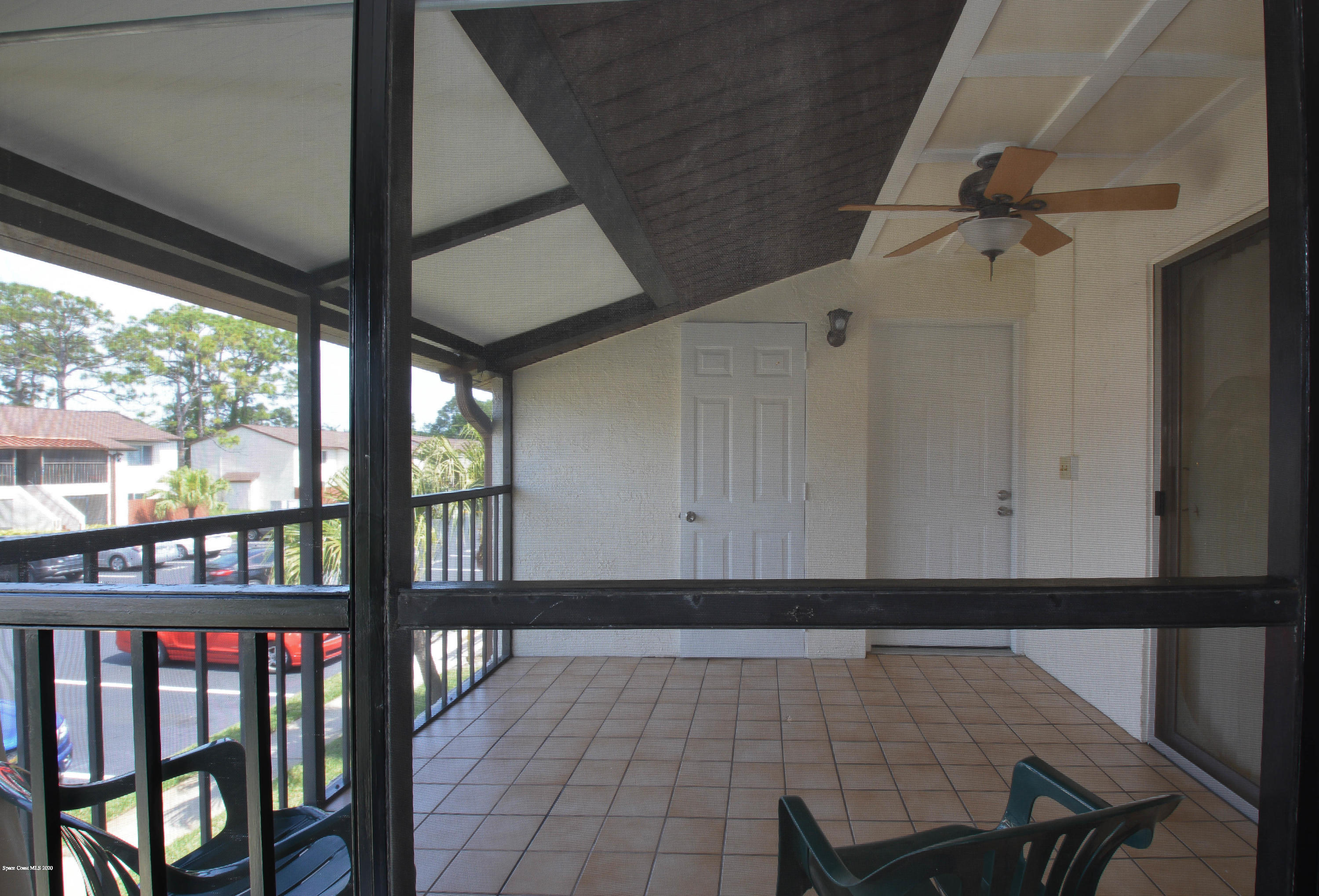 610 North Wickham Road, Unit 74 Melbourne, FL 32935 - Photo 28 of 46 a view of a hallway with furniture