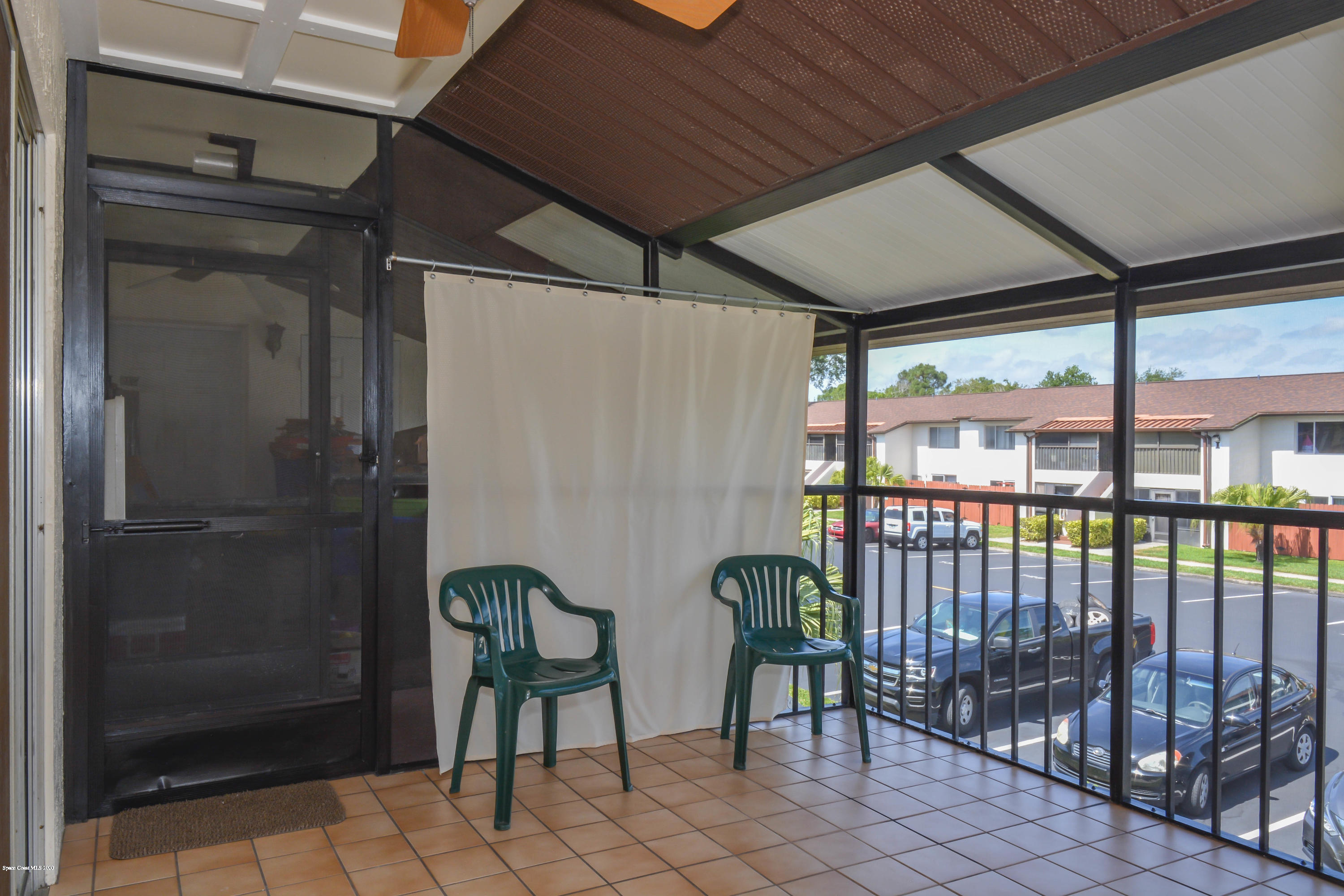 610 North Wickham Road, Unit 74 Melbourne, FL 32935 - Photo 29 of 46 a view of a balcony with chairs