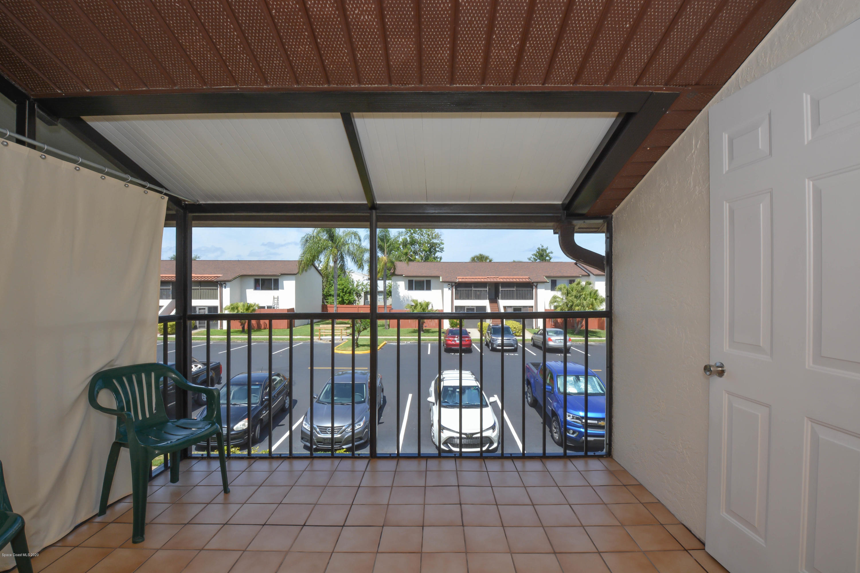 610 North Wickham Road, Unit 74 Melbourne, FL 32935 - Photo 30 of 46 a view of front door and deck