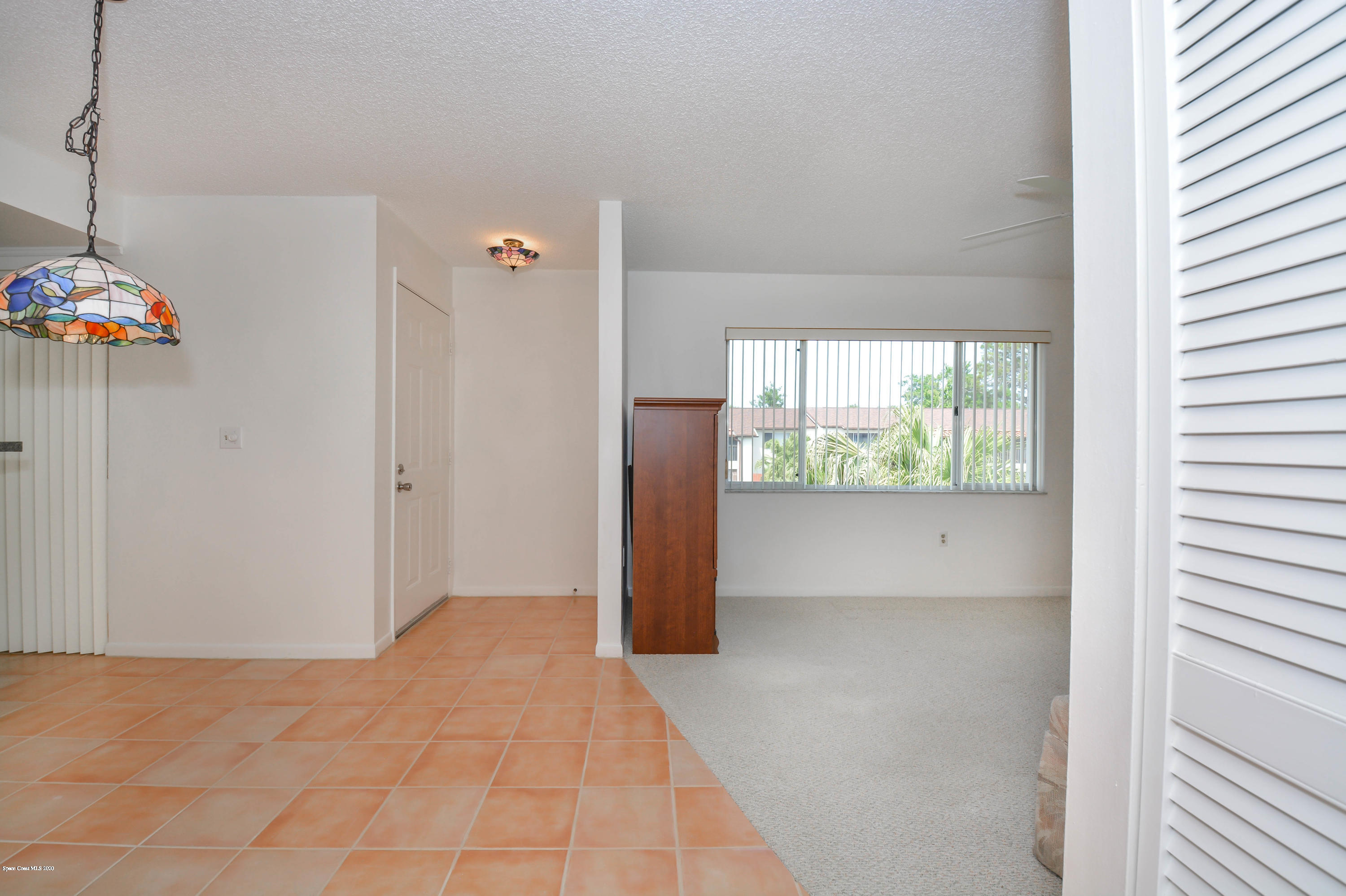 610 North Wickham Road, Unit 74 Melbourne, FL 32935 - Photo 31 of 46 a view of an empty room with a window