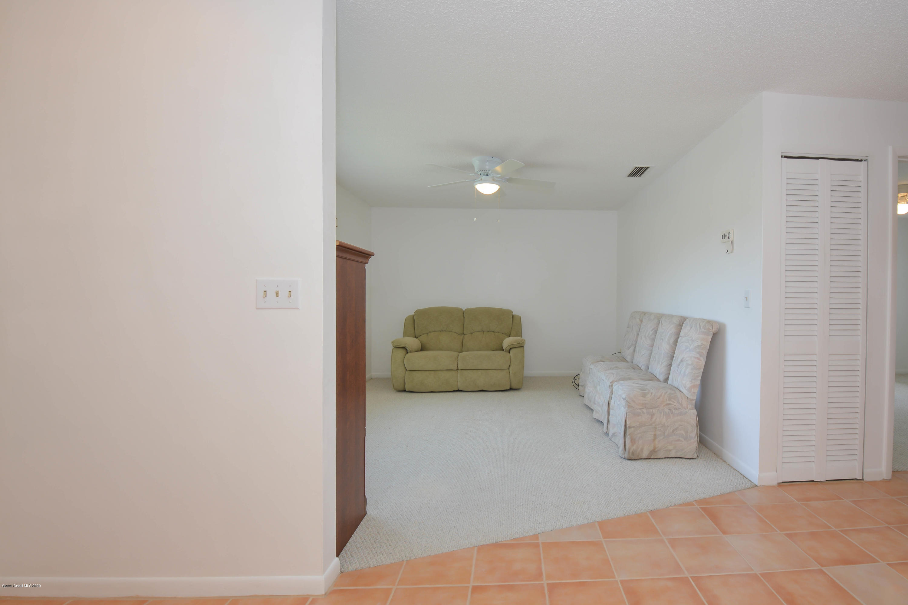 610 North Wickham Road, Unit 74 Melbourne, FL 32935 - Photo 32 of 46 a living room with furniture
