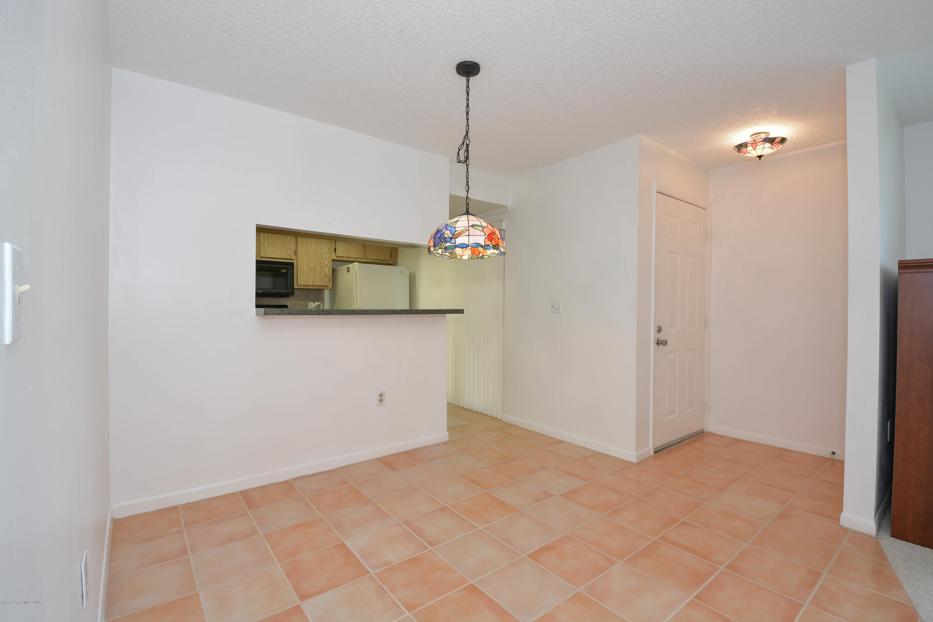 610 North Wickham Road, Unit 74 Melbourne, FL 32935 - Photo 7 of 46 a view interior of a house and chandelier fan
