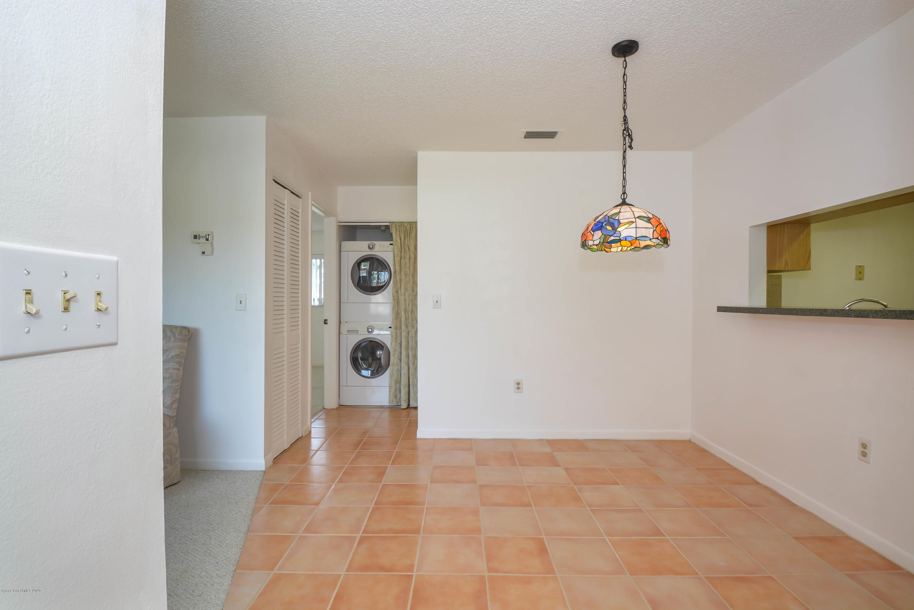 610 North Wickham Road, Unit 74 Melbourne, FL 32935 - Photo 8 of 46 a view of an empty room and window