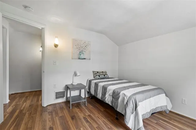 a view of a room with wooden walls