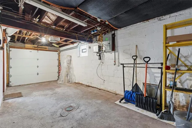 an aerial view of a house with a garden and yard