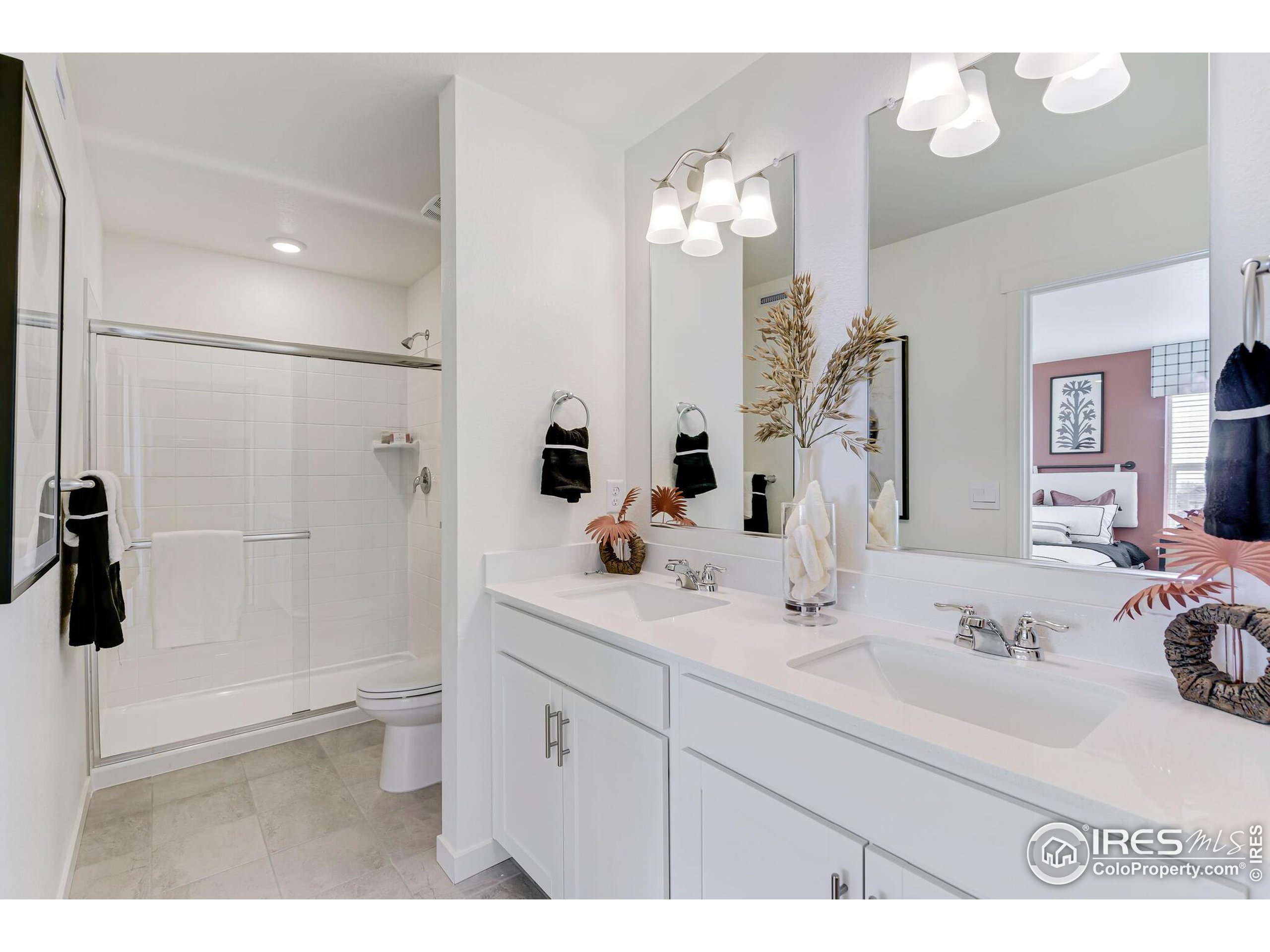 920 Logan Peak Way Berthoud, CO 80513 - Photo 22 of 35 a bathroom with a sink a toilet and shower