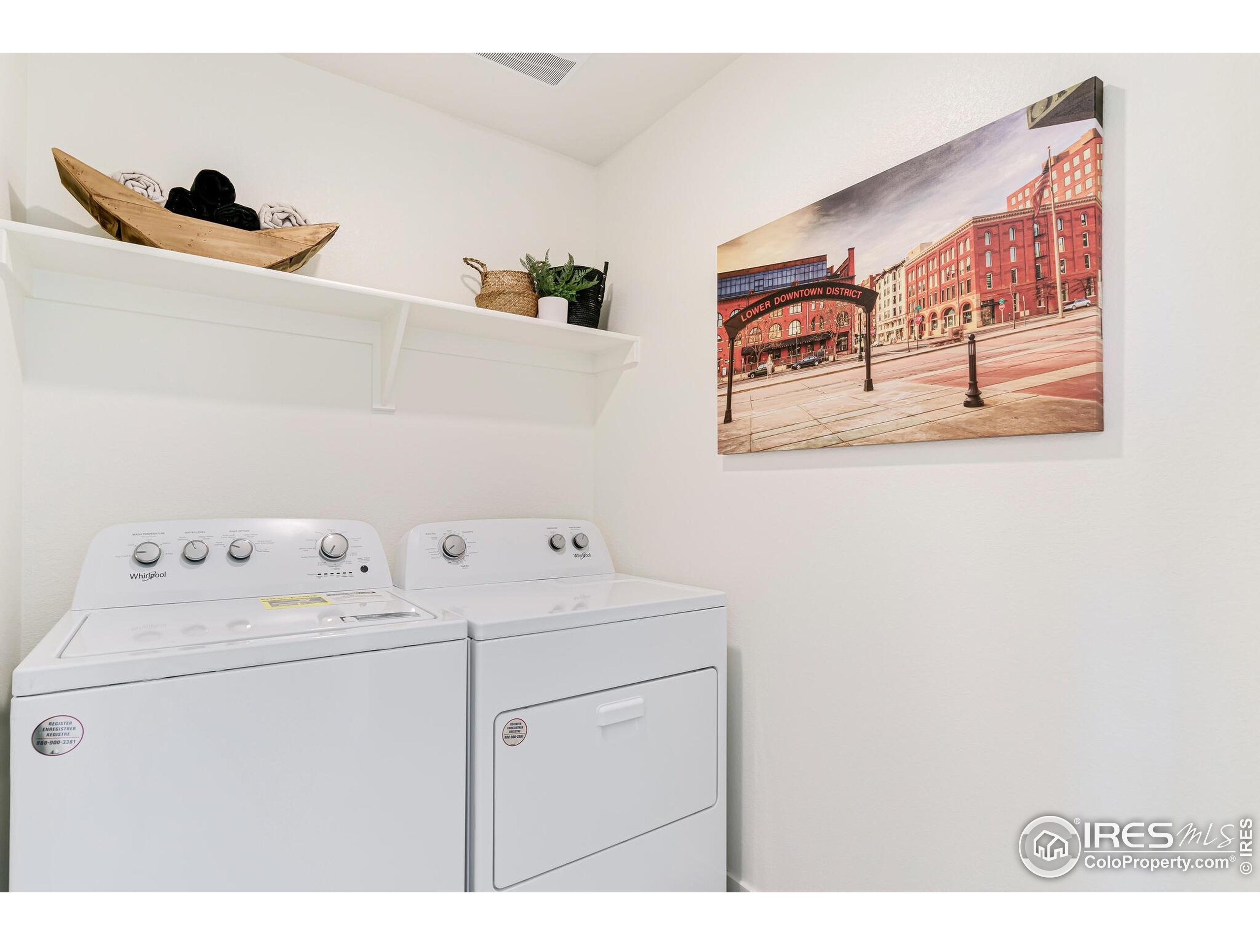 920 Logan Peak Way Berthoud, CO 80513 - Photo 25 of 35 a utility room with dryer and washer