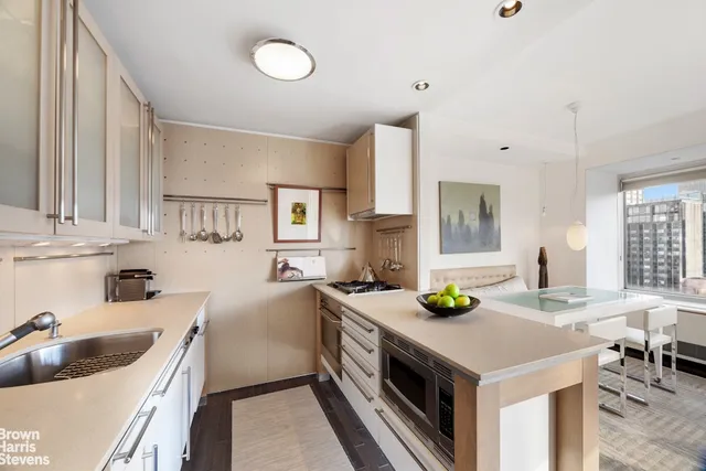 a kitchen with a stove a sink and a refrigerator