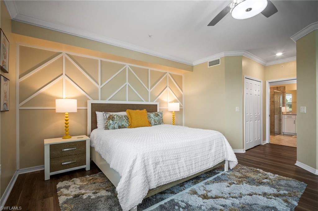 15919 Grassland Lane, Unit 4211 Babcock Ranch, FL 33982 - Photo 22 of 35 a bedroom with a bed and wooden floor