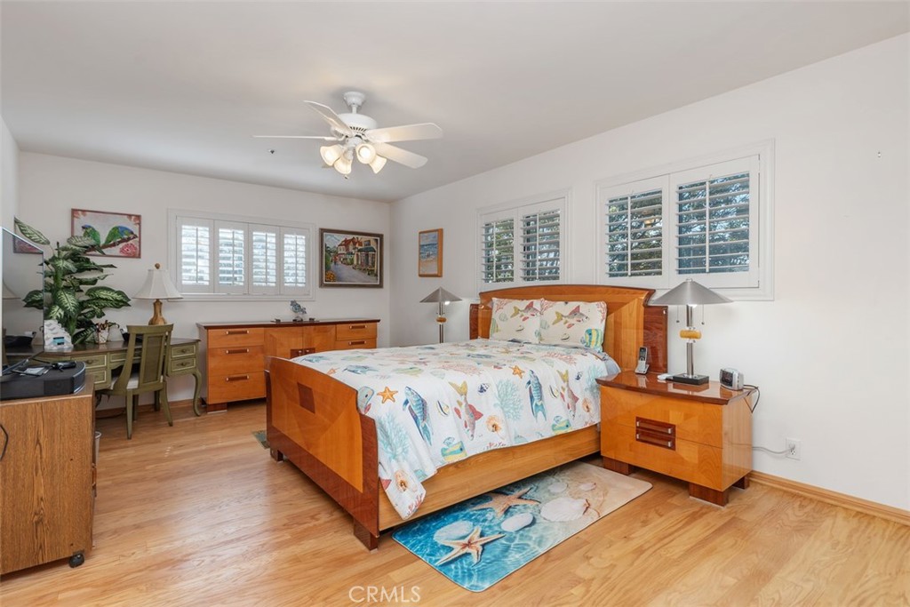 137 West Avenida Cornelio San Clemente, CA 92672 - Photo 11 of 48 a bedroom with a bed and a chandelier