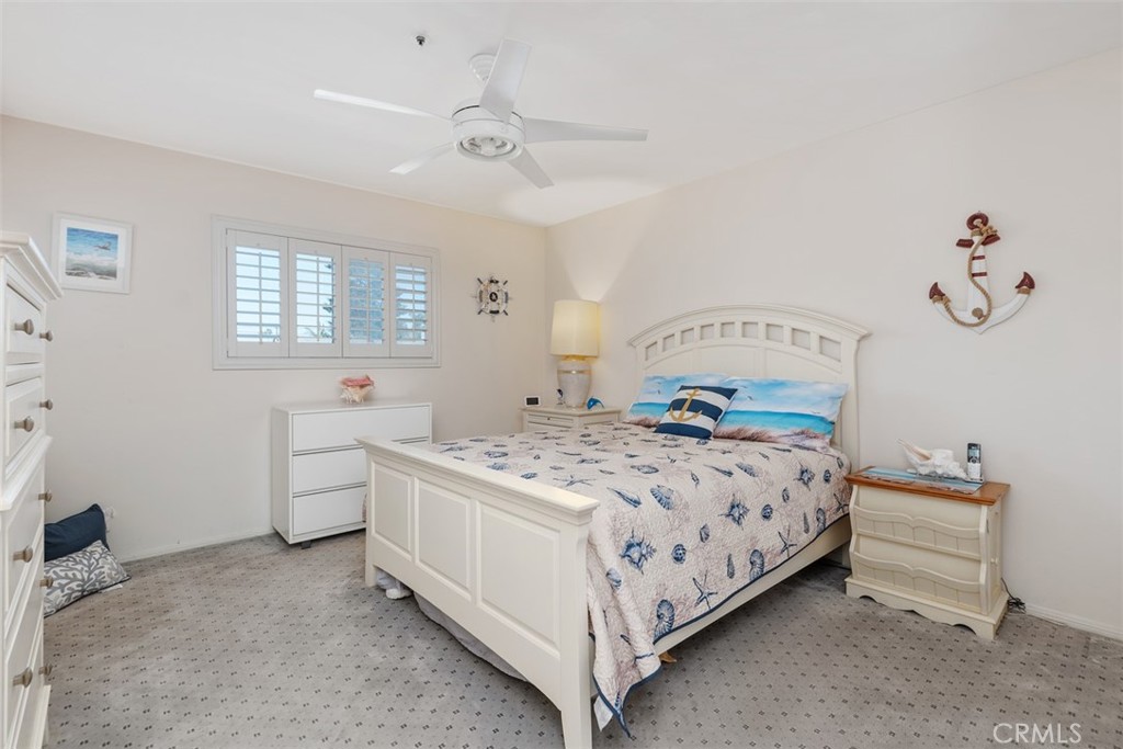 137 West Avenida Cornelio San Clemente, CA 92672 - Photo 14 of 48 a bedroom with a bed and a chandelier