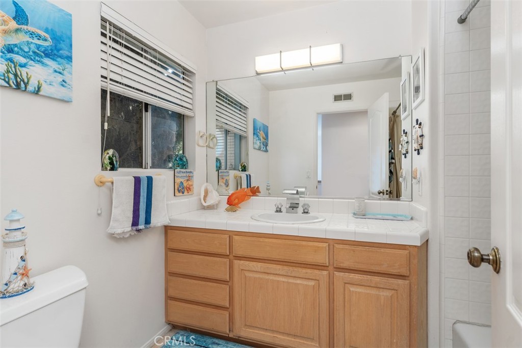 137 West Avenida Cornelio San Clemente, CA 92672 - Photo 15 of 48 a bathroom with a sink double vanity and a mirror