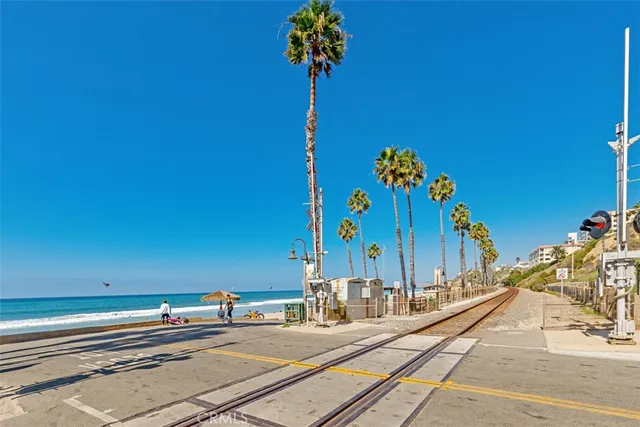 a vase of flowers sitting on a floor