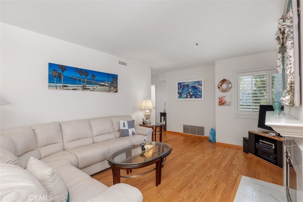 137 West Avenida Cornelio San Clemente, CA 92672 - Photo 6 of 48 a living room with furniture and a flat screen tv