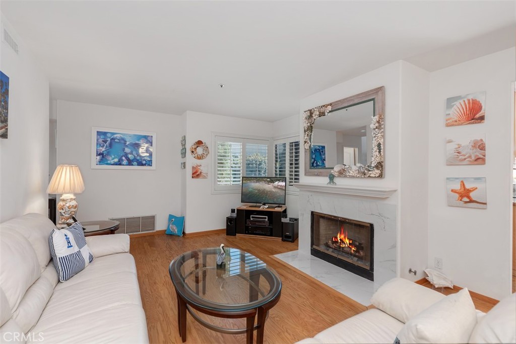 137 West Avenida Cornelio San Clemente, CA 92672 - Photo 7 of 48 a living room with furniture and a fireplace