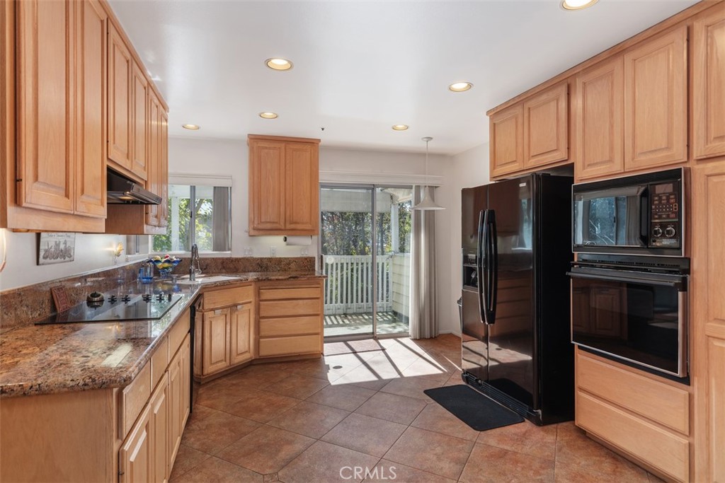 137 West Avenida Cornelio San Clemente, CA 92672 - Photo 9 of 48 a large kitchen with stainless steel appliances granite countertop a refrigerator stove and sink