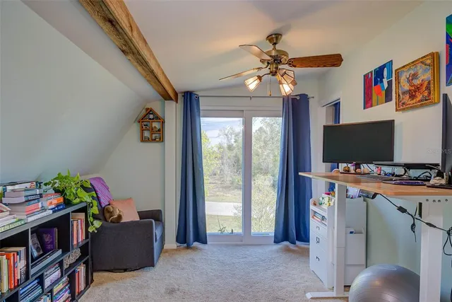 a view of a livingroom with furniture and a flat screen tv