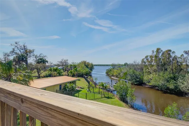 a view of a lake from a balcony