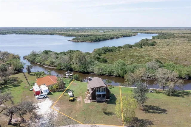 aerial view of a house with a lake view
