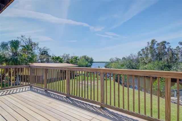 a view of balcony with wooden floor