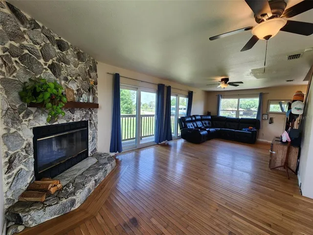 a living room with furniture fireplace and flat screen tv