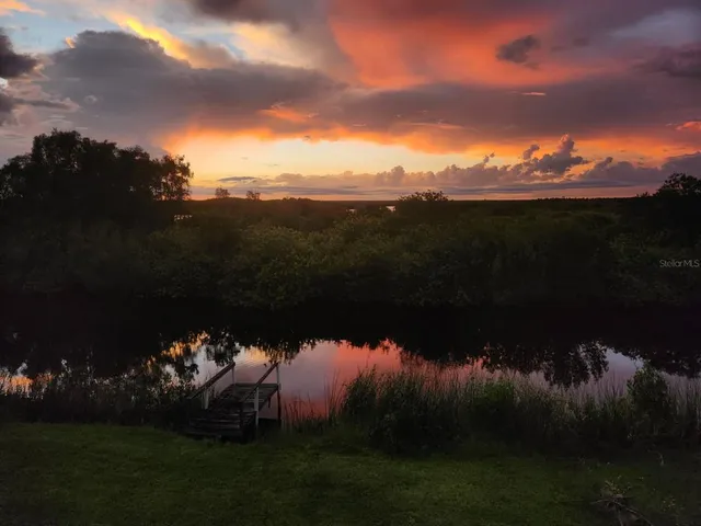 a view of a lake and a yard