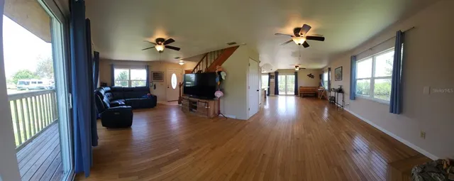 a view of a living room and hardwood floor