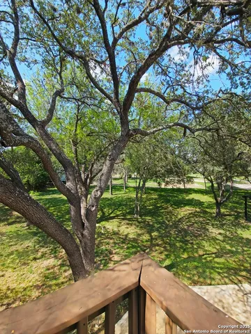 a view of a garden from a lake view