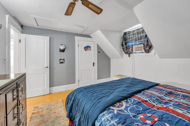 a bedroom with a bed and a cabinet