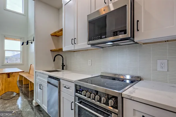 a view of cabinets and window