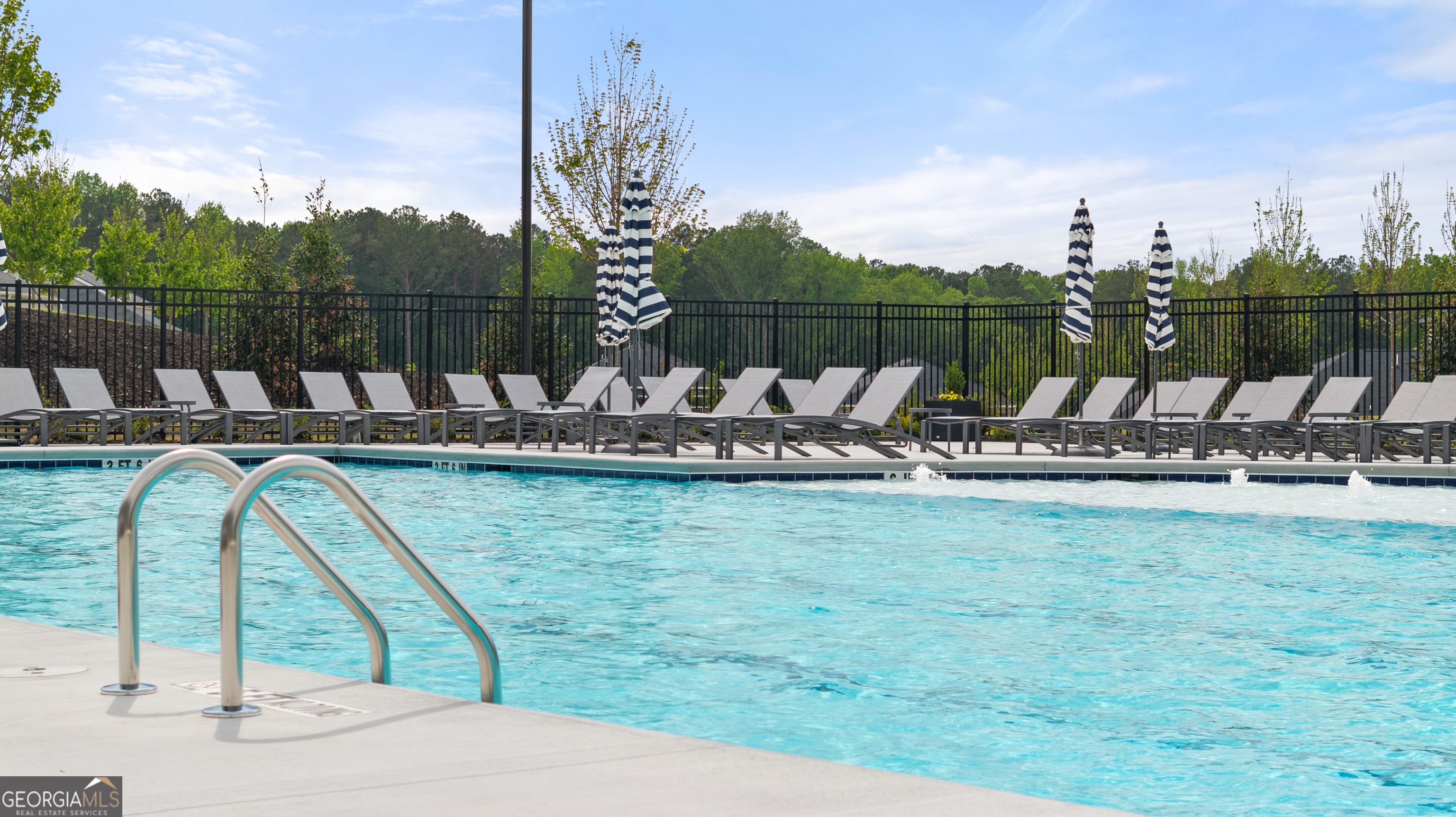 8583 Preakness Pass Snellville, GA 30039 - Photo 29 of 30 a view of a lake with a swimming pool