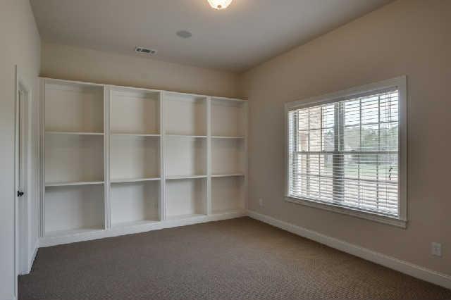 1400 Franklin Road Brentwood, TN 37027 - Photo 16 of 20 Bedroom #5 is on the lower level with built in shelving and a large walk-in closet.