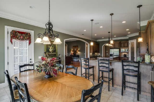 1400 Franklin Road Brentwood, TN 37027 - Photo 6 of 20 Eat-in kitchen offers room for a large table plus bar stools. Access to main level patio and large windows for lots of natural light.