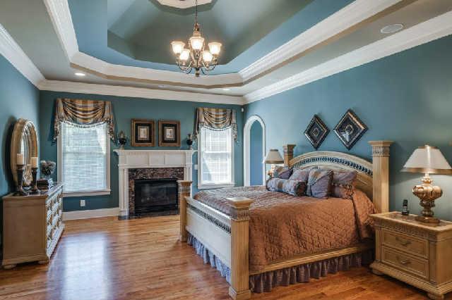 1400 Franklin Road Brentwood, TN 37027 - Photo 7 of 20 Gorgeous master suite with trey ceiling, hardwoods, extensive moldings, fireplace with marble surround and chandelier. Plenty of wall space for furniture.