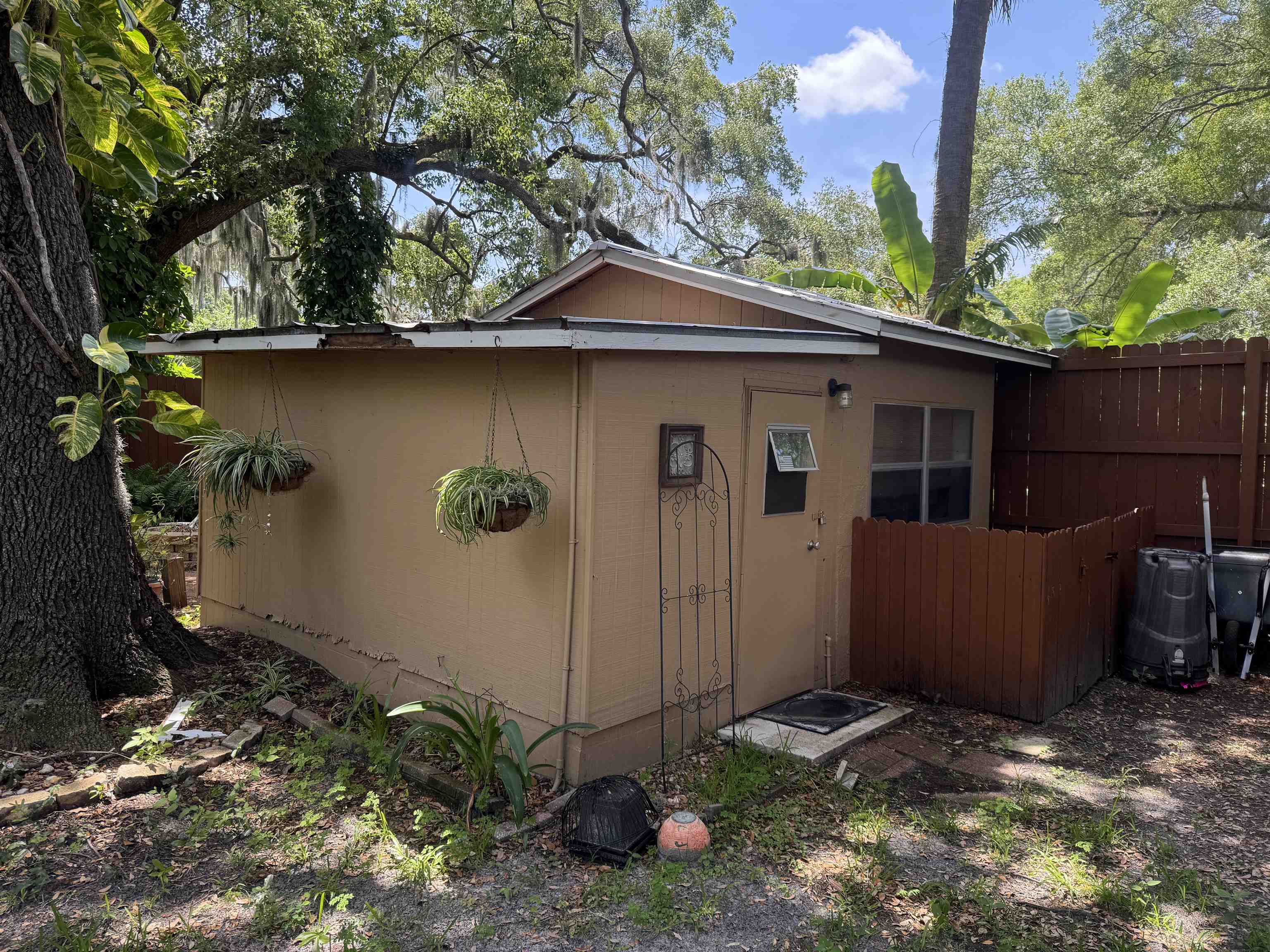 203 Estrada Avenue St. Augustine, FL 32084 - Photo 11 of 12 a backyard of a house with table and chairs